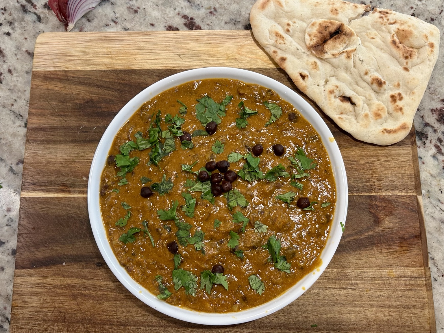 Kala chana curry with cilantro and naan