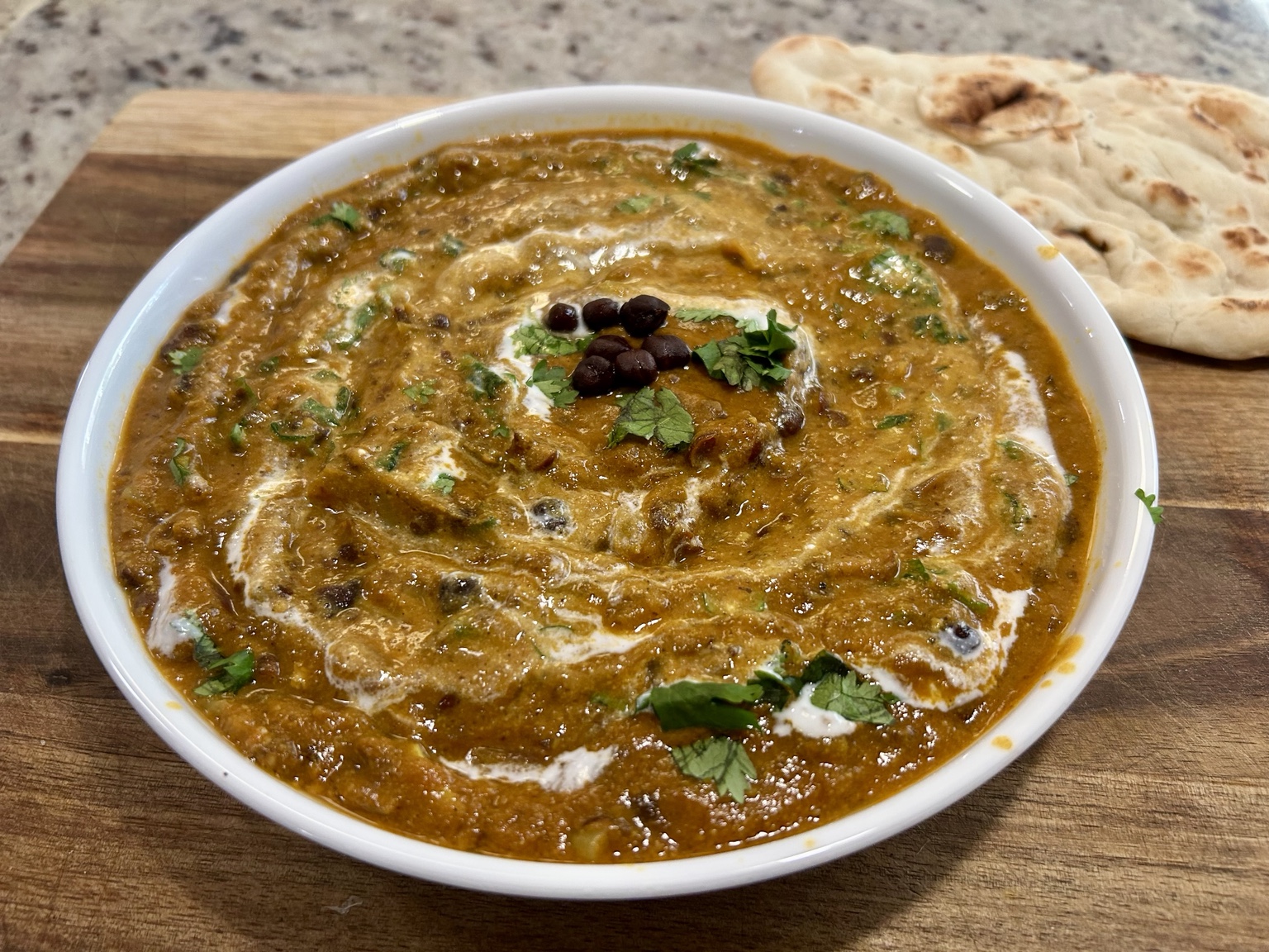 Creamy kala chana curry finished with yoghurt